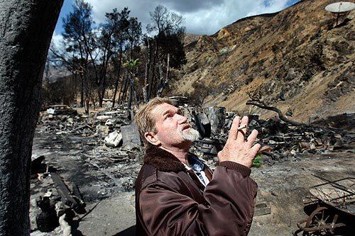 Julius Goff, a resident of Vogel Flats in Big Tujunga Canyon for seven years, stands amid the remains of his home, which was destroyed in the Station fire. He and another resident were criticized by Gov. Arnold Schwarzenegger and other authorities for thinking they could ride out the blaze by jumping into a hot tub. Goff, a 50-year-old single father who suffered severe burns, says he did not ignore a mandatory evacuation order -- he stayed behind to warn 10 neighbors who did not receive the order. By the time he got to his own home, to collect a roommate, the fire had surrounded them.