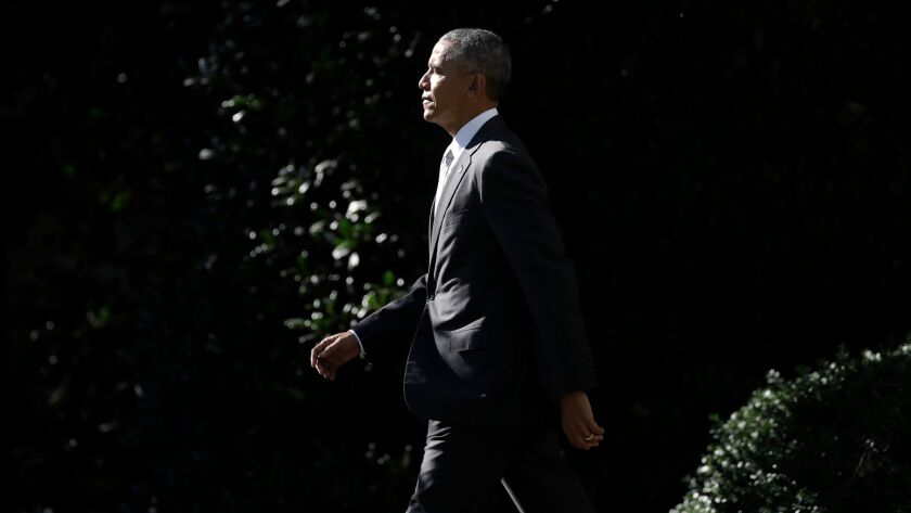 President Barack Obama walks across the South Lawn of the White House on Oct. 28.