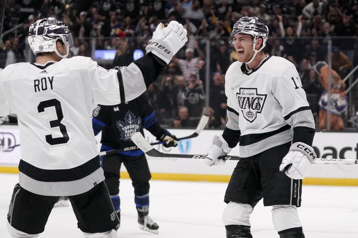 The Kings' Gabriel Vilardi, right, celebrates with teammate Matt Roy after Vilardi scored a second-period goal Oct. 29, 2022.