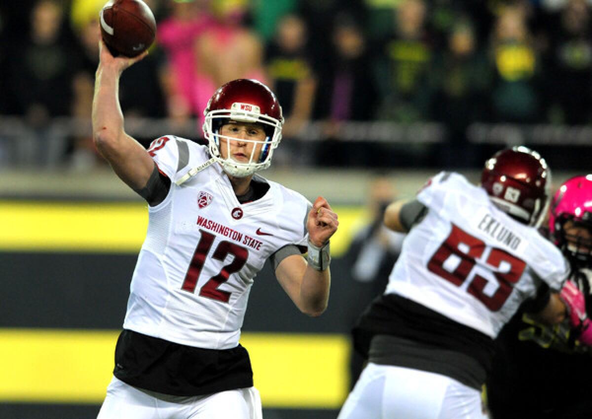 Washington State quarterback Connor Halliday gets off one of his 89 passes against Oregon on Saturday night in Eugene.