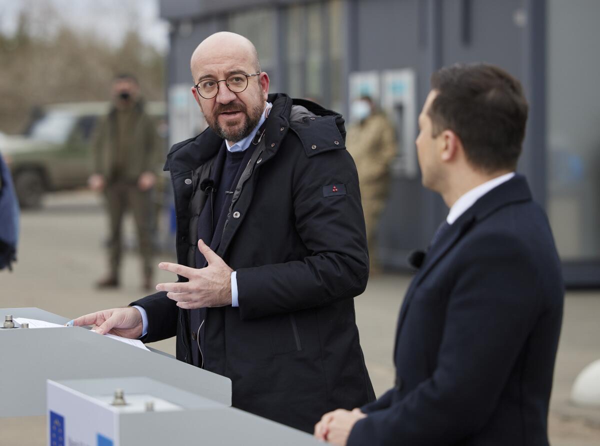 In this photo provided by the Ukrainian Presidential Press Office, Ukrainian President Volodymyr Zelenskiy, right, and European Council President Charles Michel attend a joint news briefing in the town of Shchastya in the war-hit Luhansk region, eastern Ukraine, Tuesday, March 2, 2021. (Ukrainian Presidential Press Office via AP)