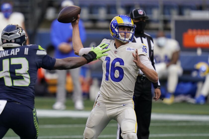 Los Angeles Rams quarterback Jared Goff (16) passes under pressure from Seattle Seahawks.