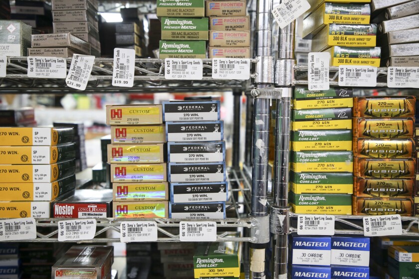 Boxes of ammo sits on shelves at Dong’s Guns, Ammo and Reloading in Tulsa, Okla.