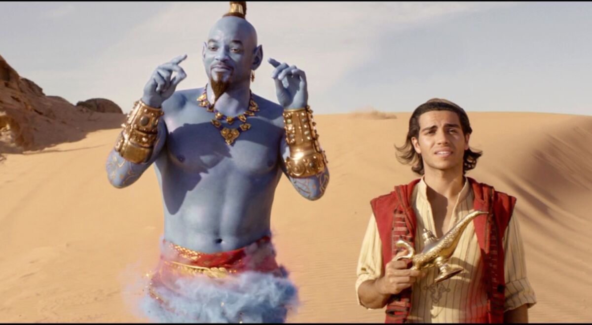 Will Smith (left) stars as the Genie, with Mena Massoud as Aladdin, in Disney's live-action reboot of "Aladdin."
