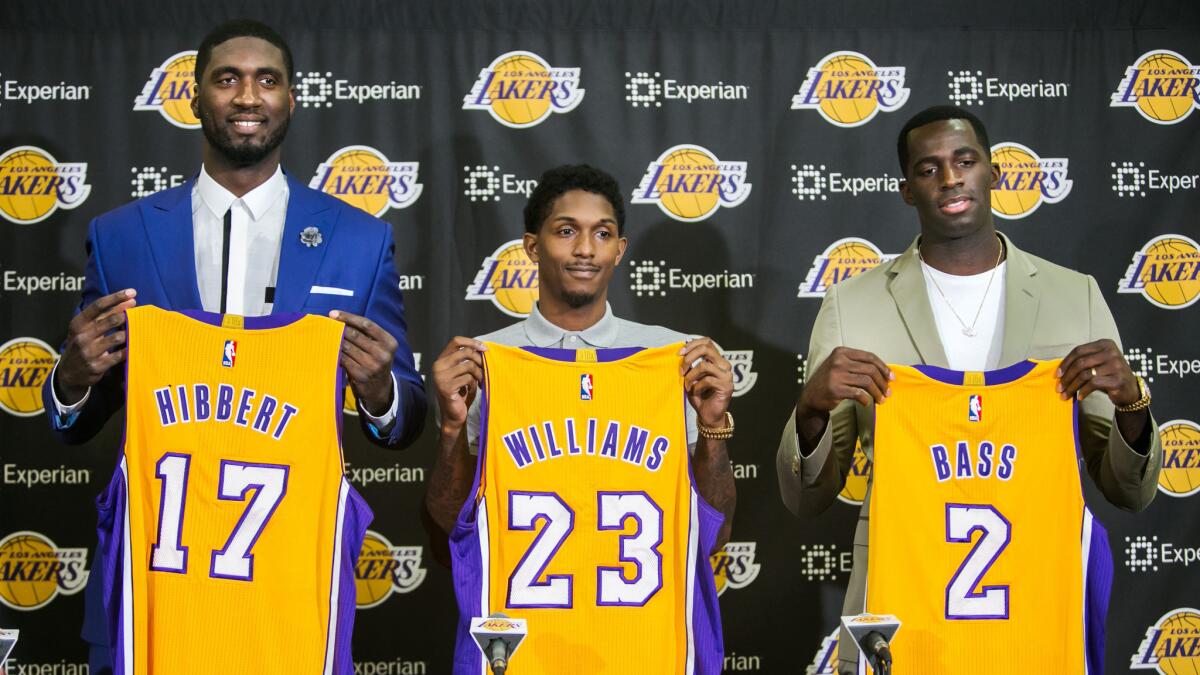 Lakers teammates, from left, Roy Hibbert, Lou Williams and Brandon Bass are formally introduced by the team during a news conference in El Segundo on Wednesday.