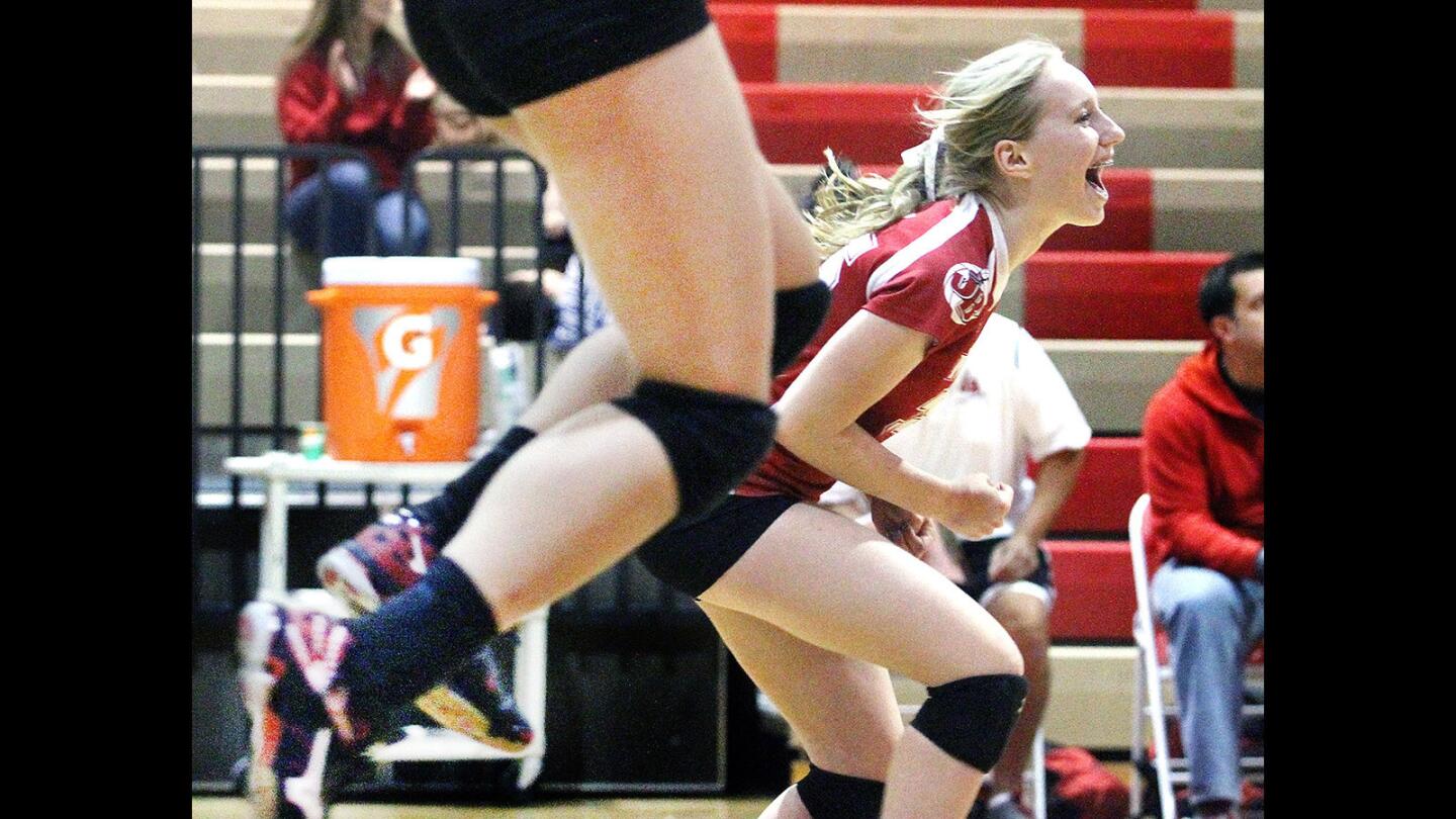 Burroughs' Payton Jenson screams to celebrate winning the match and game against Pacifica Oxnard in a CIF Southern Section volleyball match at Burroughs High School on Tuesday, November 10, 2015. Burroughs won the match 3-0.