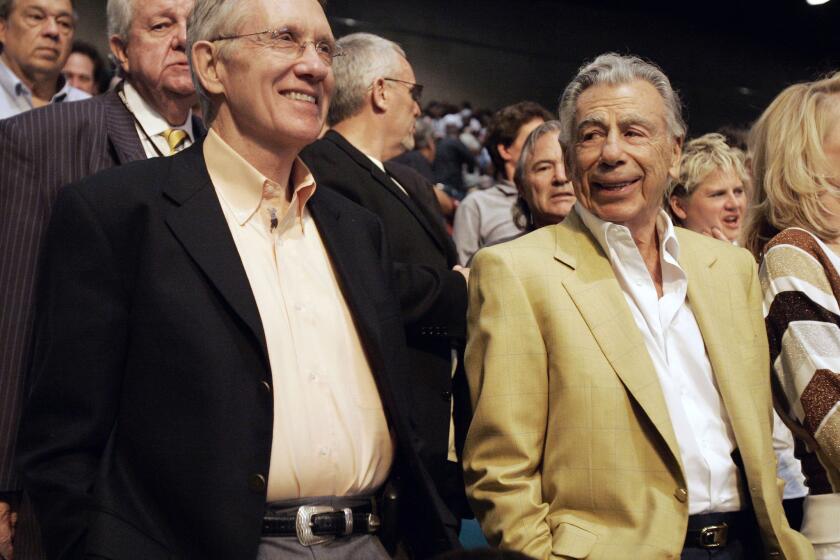 Senate Majority Leader Harry Reid, left, and Kirk Kerkorian attend the Oscar De La Hoya and Floyd Mayweather Jr. boxing match on May 5, 2007, at the MGM Grand Garden Arena in Las Vegas.