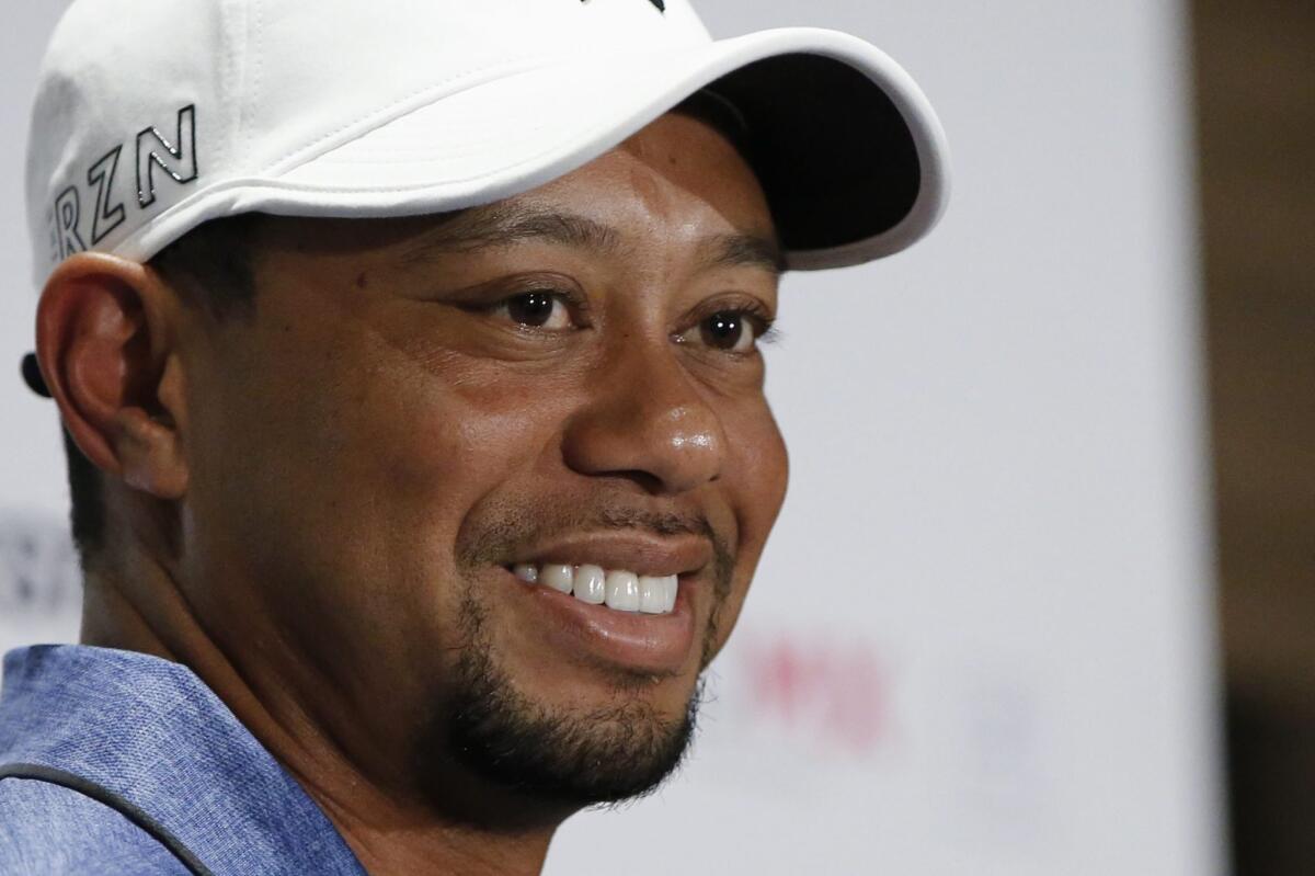 Tiger Woods, shown in October, told Time magazine he was honest with his kids about why he does not live with their mother.