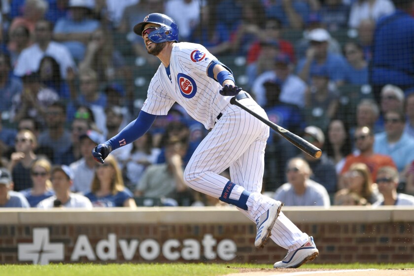 FILE - In this Sept. 15, 2019, file photo, Chicago Cubs' Kris Bryant watches his three-run home run during the first inning of a baseball game against the Pittsburgh Pirates in Chicago. Bryant avoided arbitration with the Cubs, agreeing Friday, Jan. 10, 2010, to an $18.6 million, one-year contract, a person familiar with the situation told The Associated Press. The person spoke on the condition of anonymity because the deal had not been announced. (AP Photo/Paul Beaty, File)