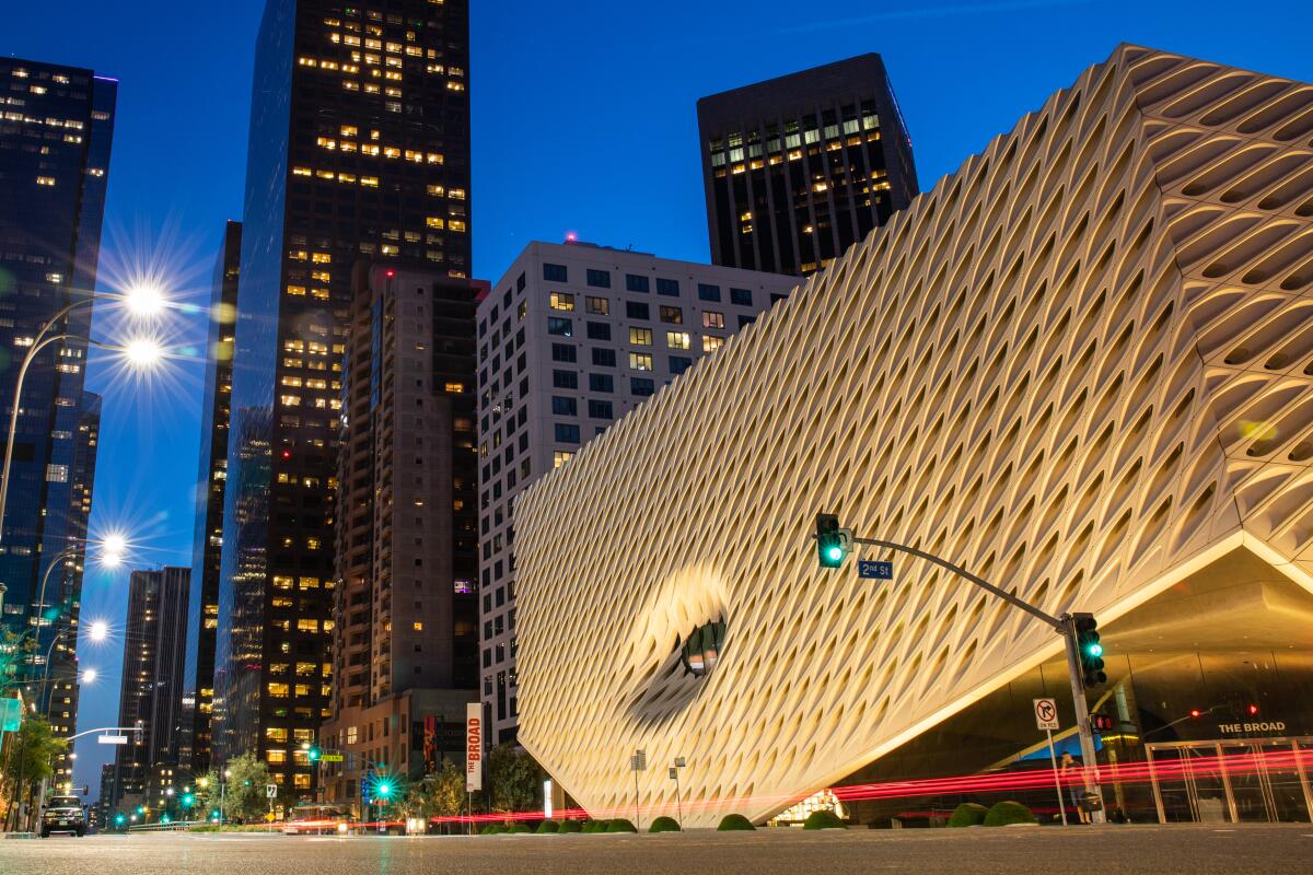 The Broad Museum is seen with downtown L.A. skyscrapers in the background
