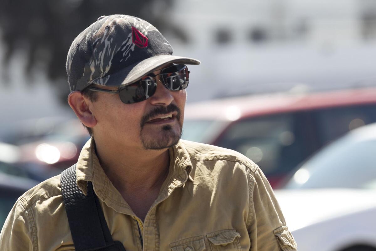 A man in sunglasses and a cap