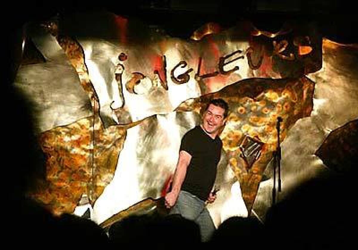 Greg Burns takes the stage at Jongleurs, a club whose formula of comedy followed by disco has proved a hit.
