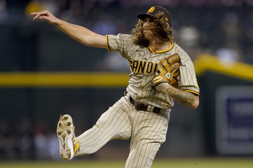 Padres starting pitcher Mike Clevinger throws against the Diamondbacks 