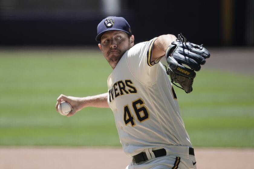 Milwaukee Brewers' Corey Knebel throws during a practice session Monday, July 13, 2020, at Miller Park in Milwaukee. (AP Photo/Morry Gash)