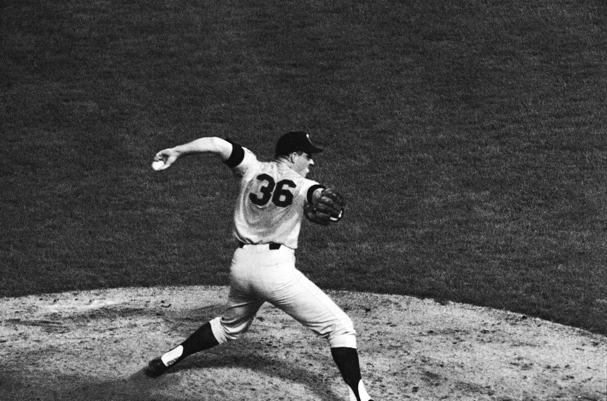 FILE - Minnesota Twins pitcher Jim Kaat pitches against the Kansas City Athletics in Kansas City, Mo., Sept. 18, 1967. The Twins won 2-0. The Minnesota Twins will retire the uniform number of former pitcher Jim Kaat. He was recently elected to the Hall of Fame. The Twins will add Kaat’s 36 to their wall of retired numbers during a pregame ceremony at Target Field on July 16. (AP Photo/William P. Straeter, File)