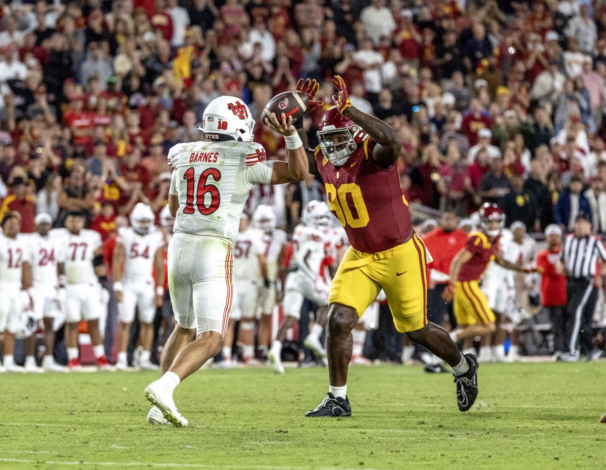 USC defensive lineman Bear Alexander is called for "roughing the passer" after running into Utah QB Bryson Barnes 