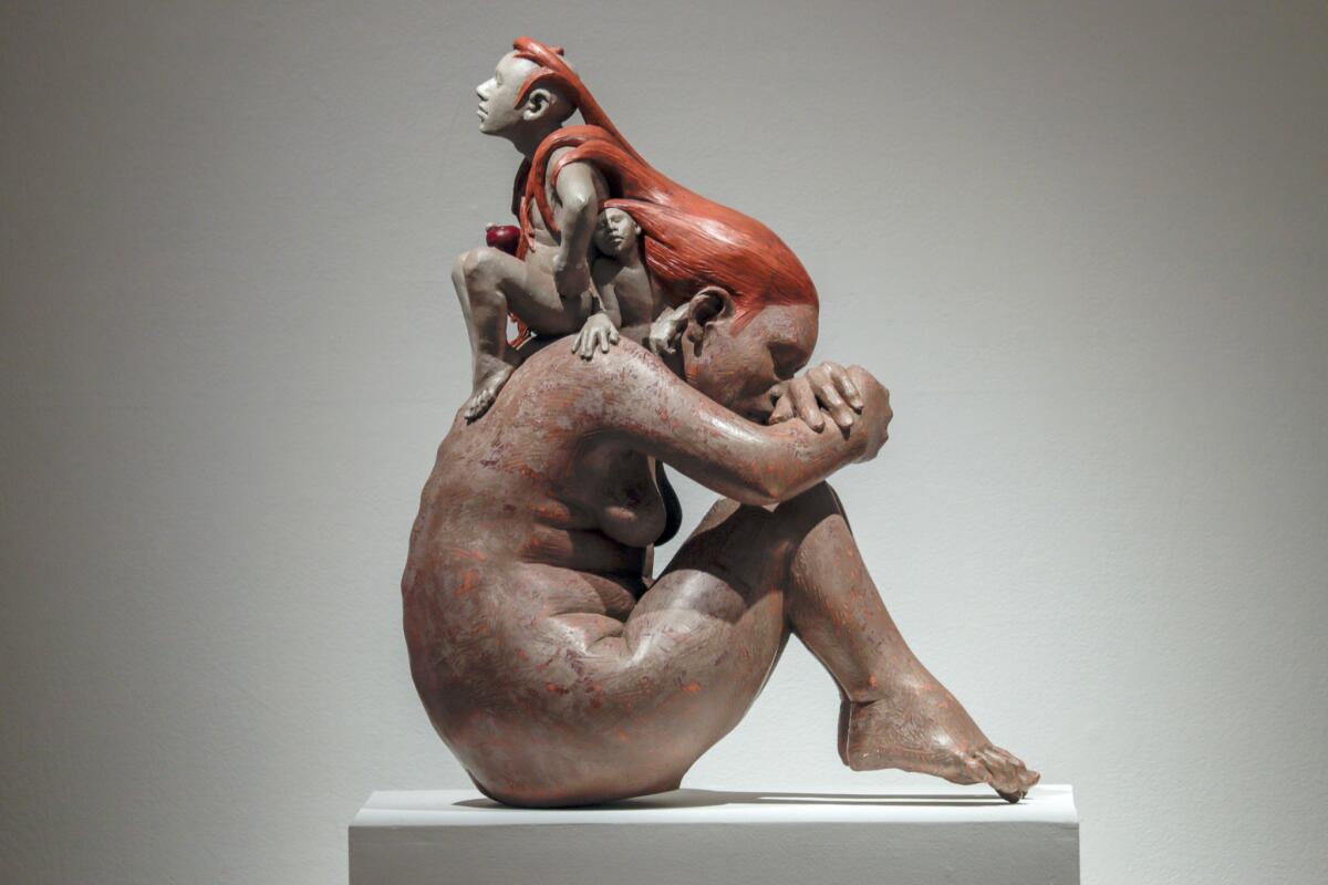 "Sitting on My Mothers Back" by Roxanne Swentzell, 2016, clay, at Scripps.