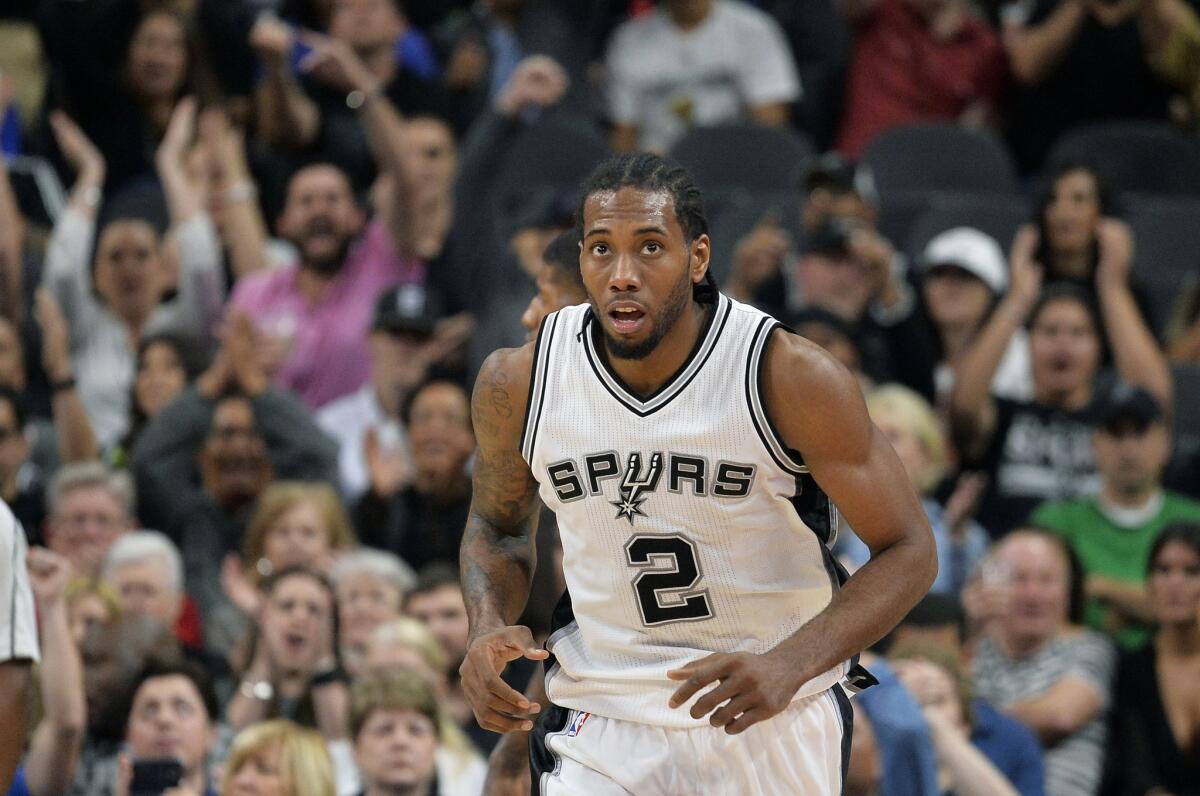 Spurs forward Kawhi Leonard runs up the court after scoring during the second half against the Pacers.