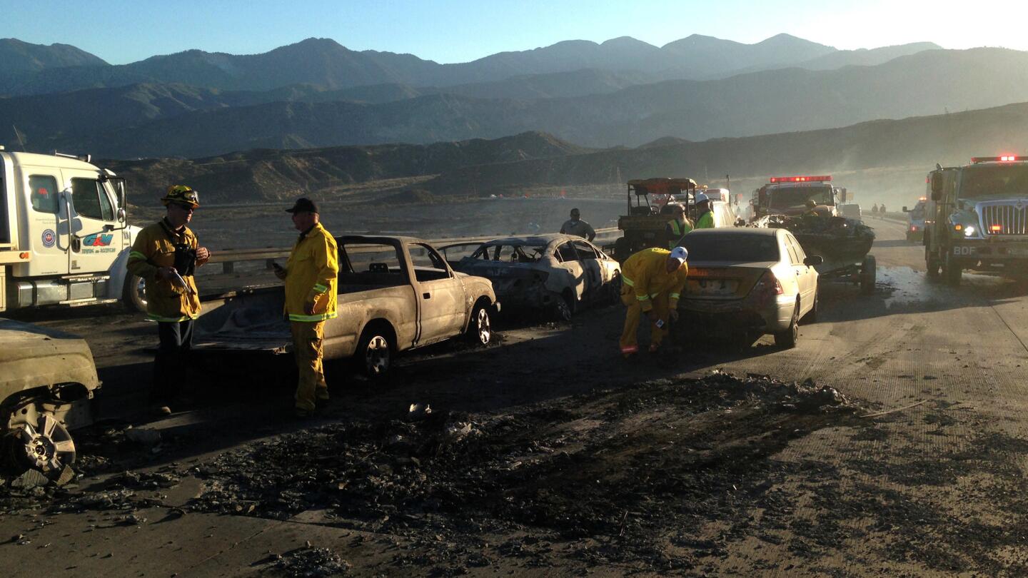 The aftermath of a brush fire that jumped Interstate 15 on July 17, 2015, in San Bernardino County, Calif.