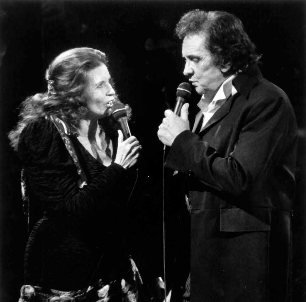 Johnny Cash performs with his wife June Carter Cash in 1991 at the Celebrity Theatre in Anaheim.