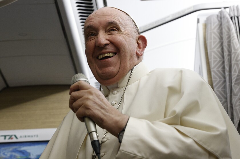 Pope Francis speaks to journalists aboard the papal plane.