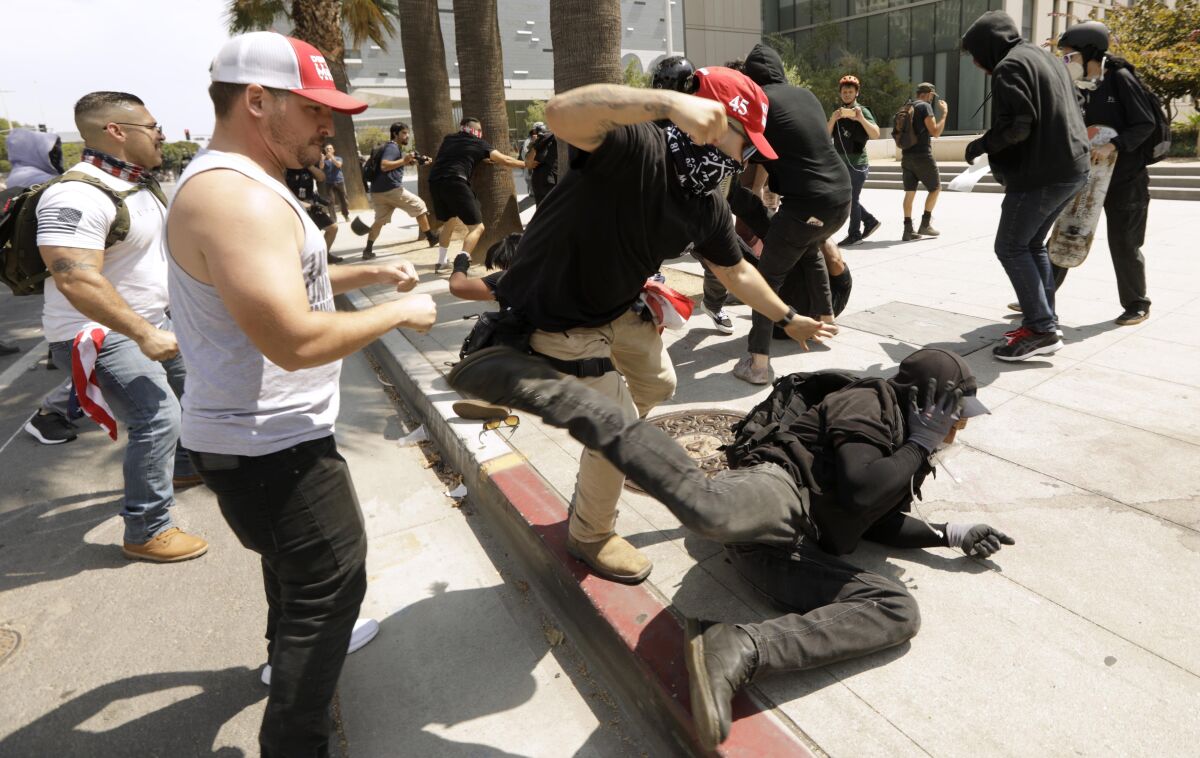 Protesters opposed to vaccine mandates brawl with counter-protesters outside LAPD headquarters.