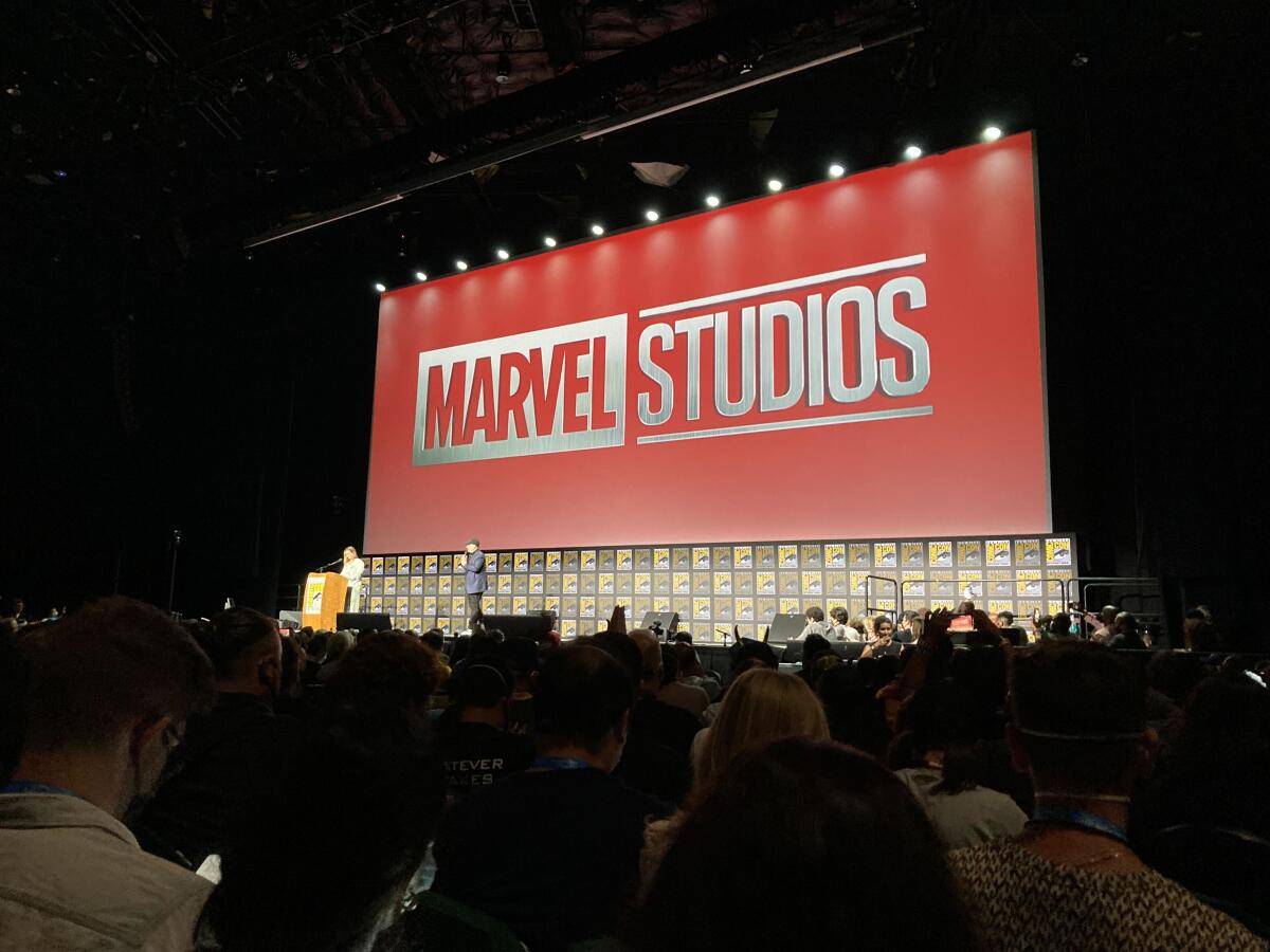 The Marvel Studios logo on a screen in front of an audience