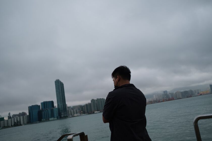 Hong Kong, China - May 24: in Alex, who was arrested and spent two years in prison stands near the water on Tuesday, May 24, 2022 in Hong Kong, China. (Hsuiwen Liu / for the Times)