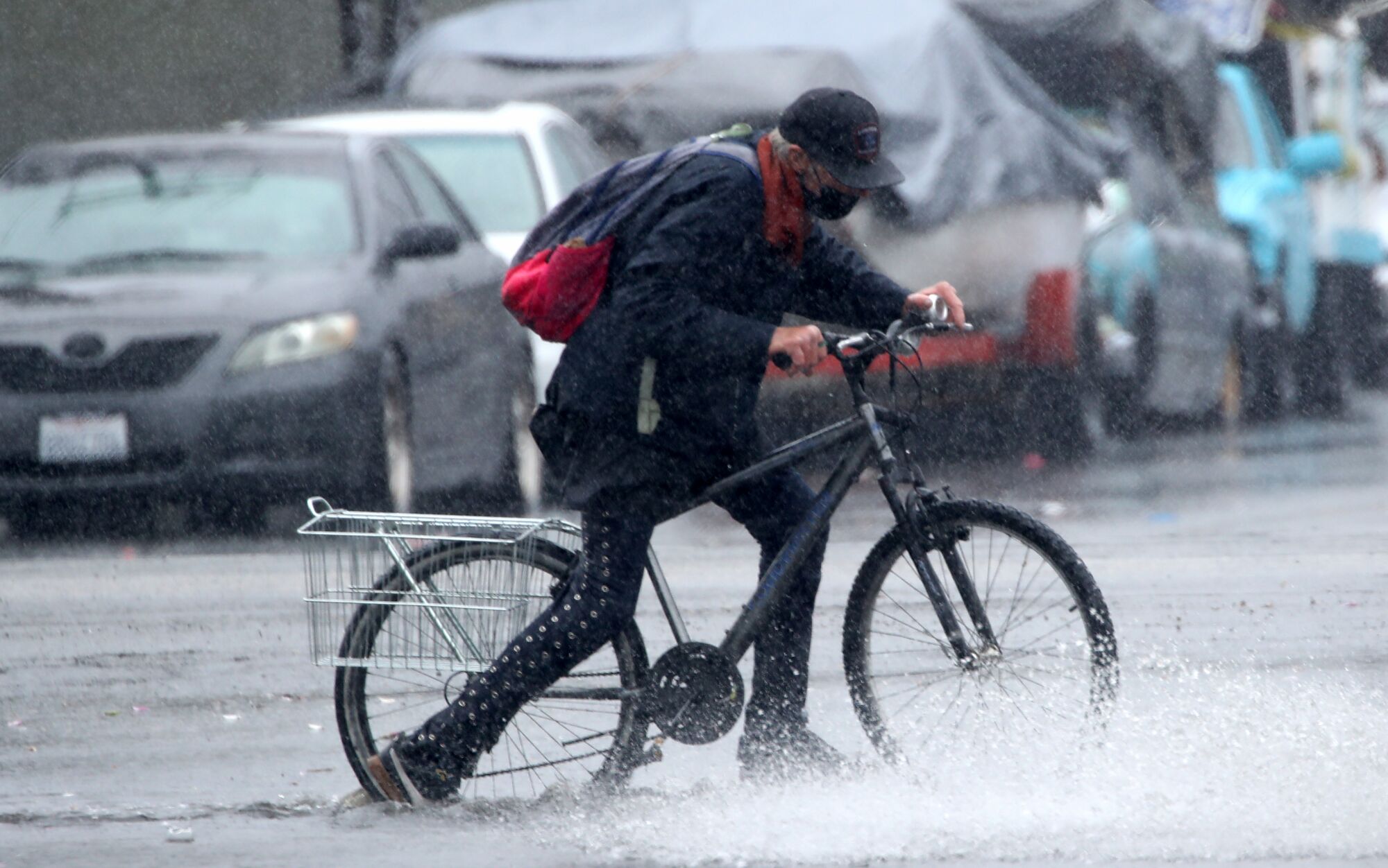 A bicyclist in rain.