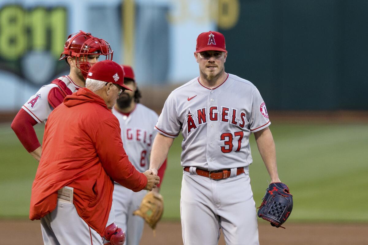 Angels manager Joe Maddon removes Dylan Bundy from Monday's game.