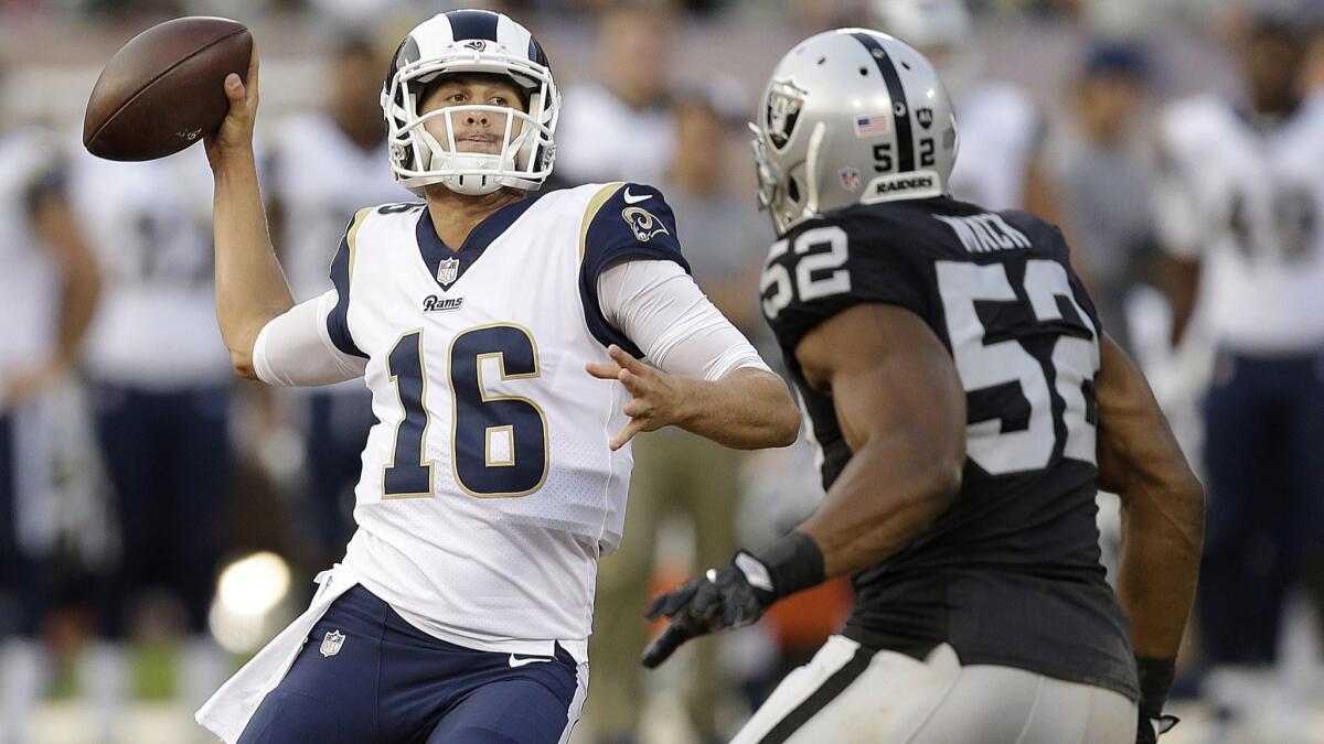Rams quarterback Jared Goff (16) passes as Oakland Raiders defensive end Khalil Mack (52) applies pressure during an NFL preseason football game in Oakland last season.