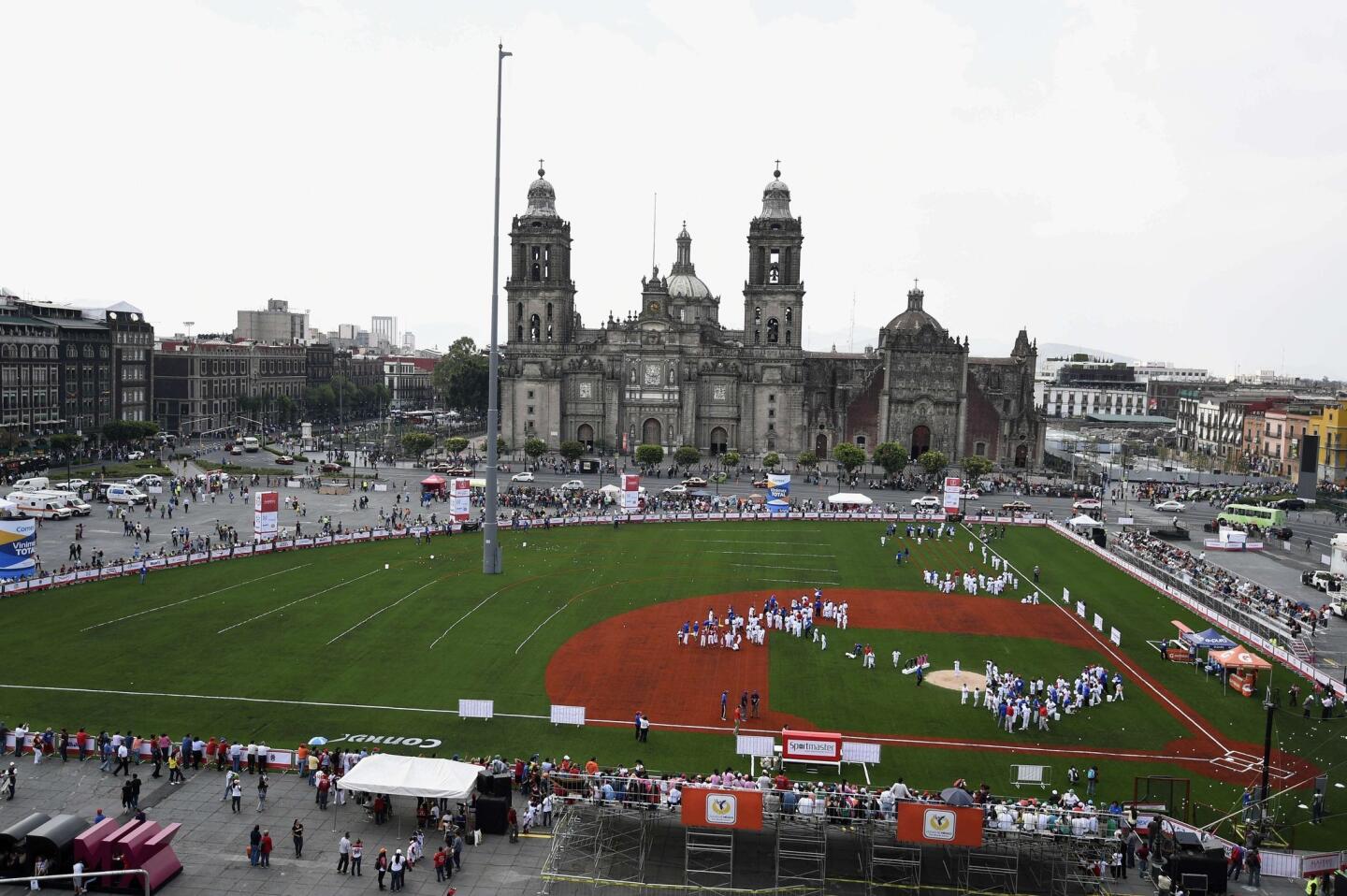 Young players train during the first day of the 90th anniversary of the Mexican Baseball League to be celebrated this weekend, at Mexico City's Zocalo square, on June 12, 2015. AFP PHOTO/ALFREDO ESTRELLAALFREDO ESTRELLA/AFP/Getty Images ** OUTS - ELSENT, FPG - OUTS * NM, PH, VA if sourced by CT, LA or MoD **