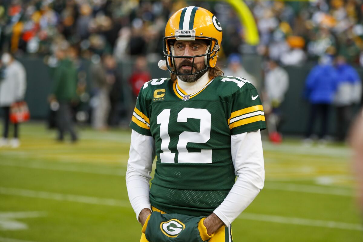 Green Bay Packers' Aaron Rodgers warms up before an NFL football game against the Los Angeles Rams Sunday, Nov. 28, 2021, in Green Bay, Wis. (AP Photo/Matt Ludtke)