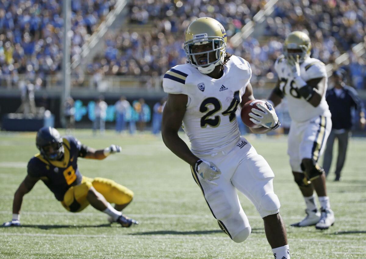 UCLA running back Paul Perkins breaks into the clear against California on a 16-yard touchdown reception in the first quarter Saturday in Berkeley.