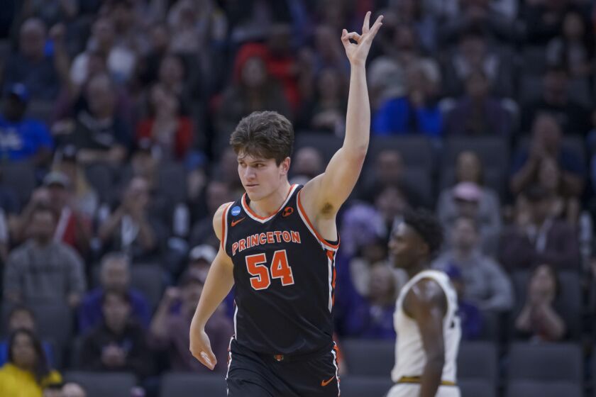 Princeton forward Zach Martini reacts after sinking a three-pointer against Missouri on March 18, 2023.
