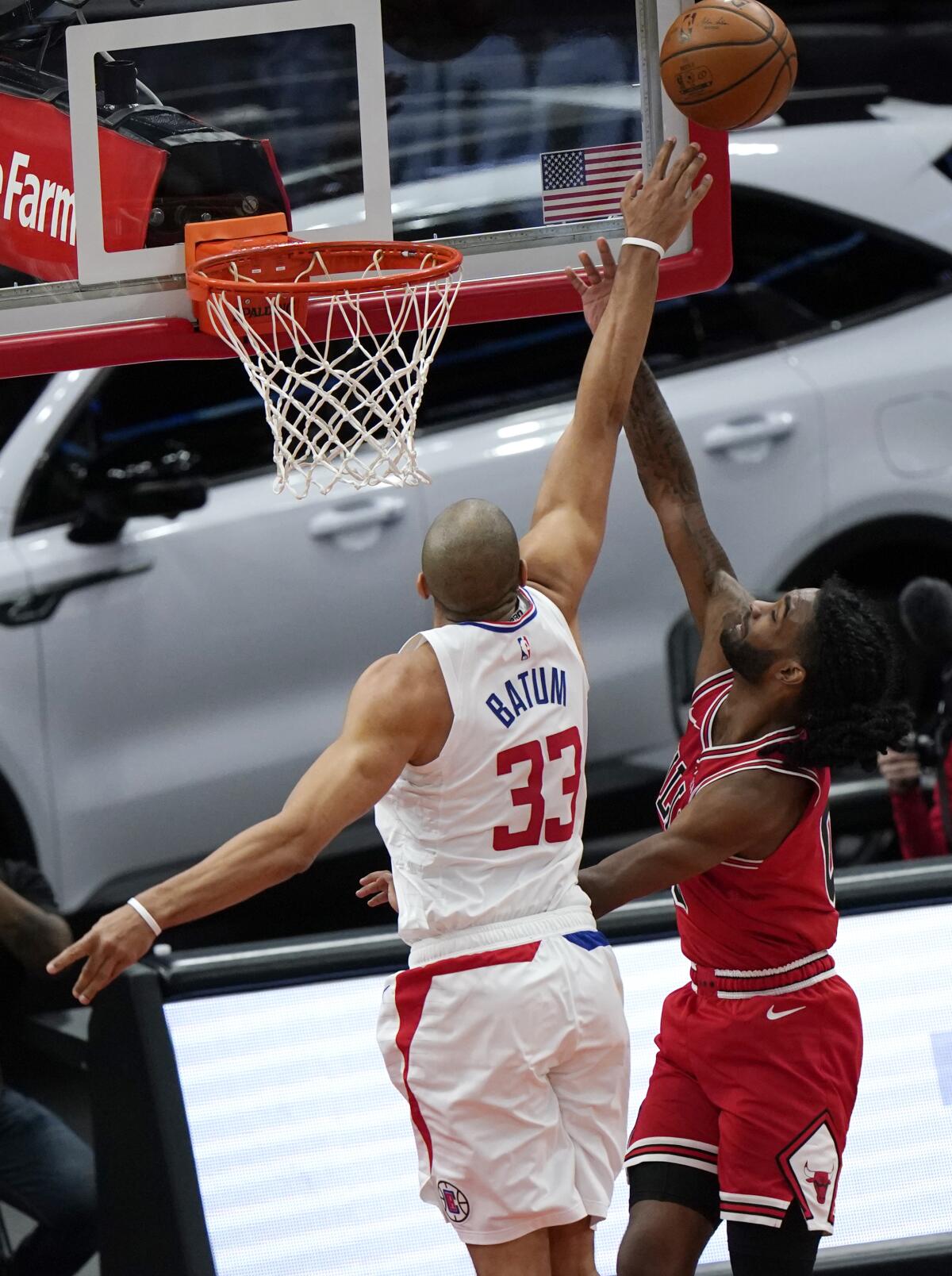 The Clippers' Nicolas Batum leaps to block a shot by the Chicago Bulls' Coby White on Feb. 12, 2021. 