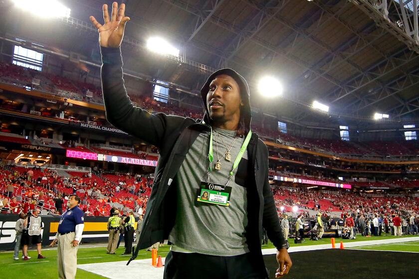 Roddy White waves to fans before the College Football Playoff championship game at University of Phoenix Stadium on Jan. 11.