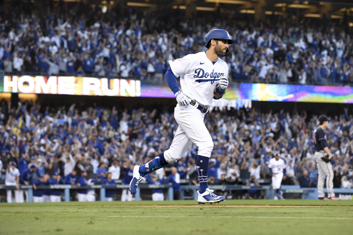 Chris Taylor rounds the bases after hitting a two-run home run in the second inning for the Dodgers.