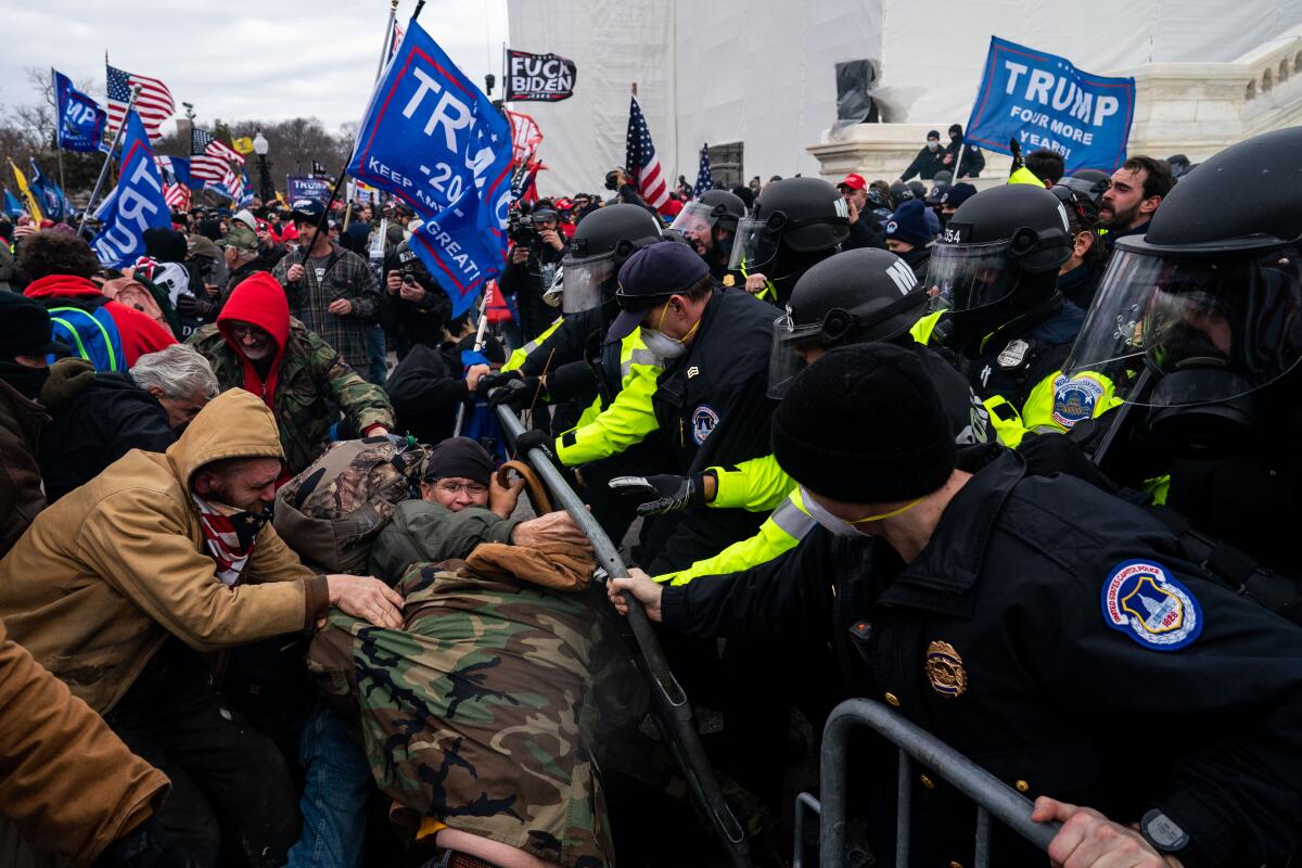 Capitol Police officers try to hold back pro-Trump supporters at the U.S. Capitol.