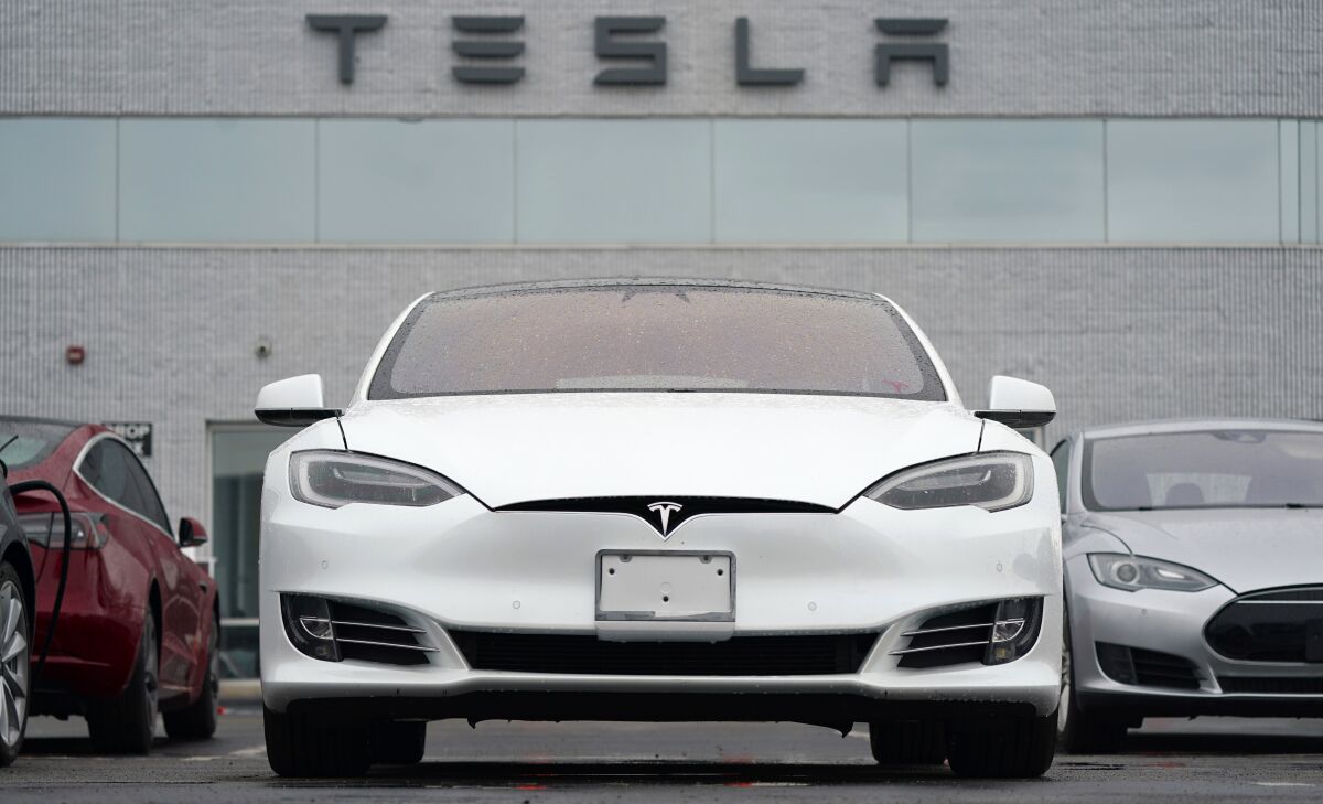 FILE -Tesla vehicles are parked at a company location in Littleton, Colo. Tesla is recalling more than 817,000 vehicles in the U.S. because the seat belt reminder chimes may not sound when the vehicles are started and the driver hasn’t bukled up. Documents posted Thursday, Feb. 3, 2022, by safety regulators say the recall covers the 2021 and 2022 Model S sedan and Model X SUV. (AP Photo/David Zalubowski, File)