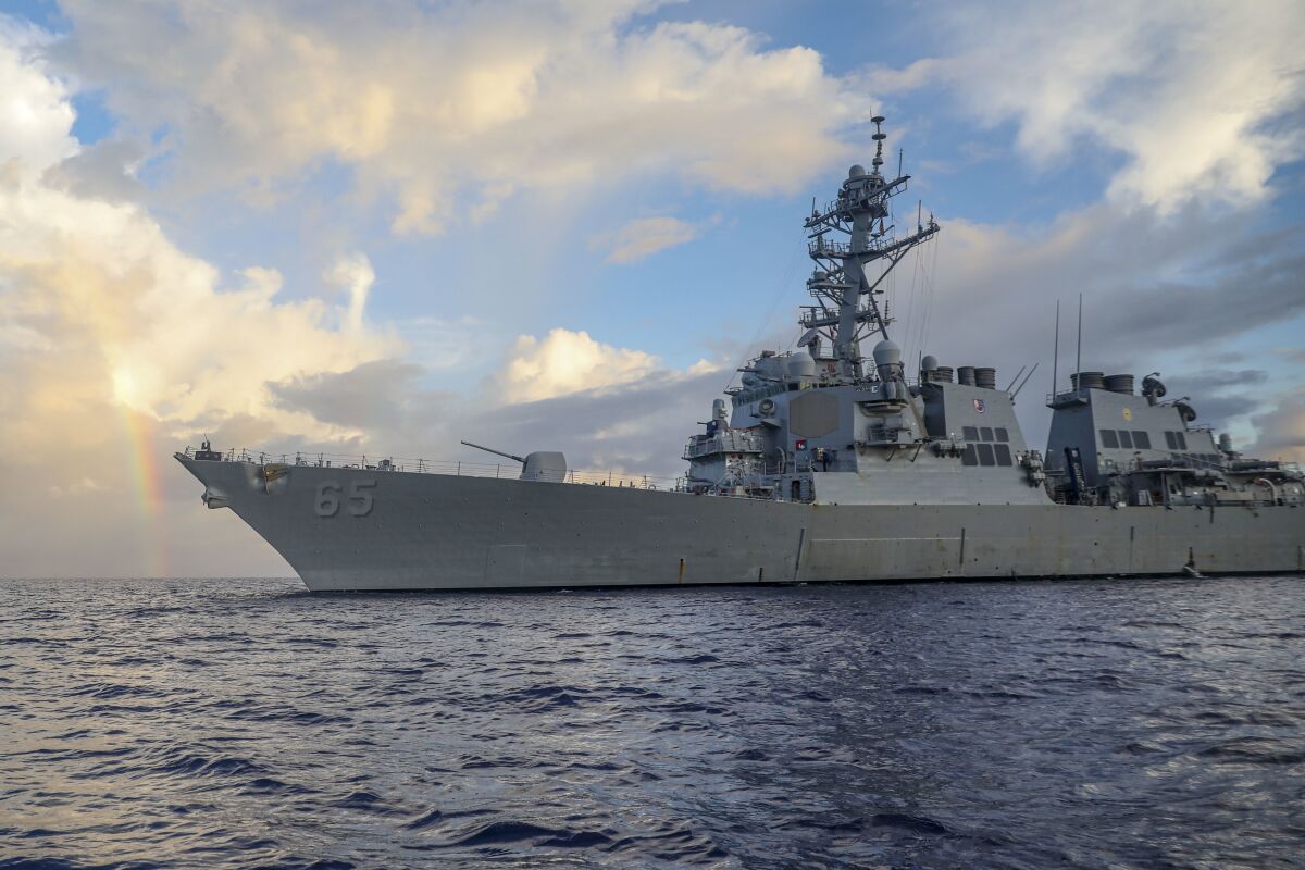 In this photo provided by U.S. Navy, Arleigh Burke-class guided-missile destroyer USS Benfold (DDG 65) conducts routine underway operations in the Philippines Sea on June 24, 2022. The U.S. Navy on Wednesday, July 13, 2022, sailed the destroyer close to China-controlled islands in the South China Sea in what Washington said was a patrol aimed at asserting freedom of navigation through the strategic seaway. (Mass Communication Specialist 2nd Class Arthur Rosen/U.S. Navy via AP)