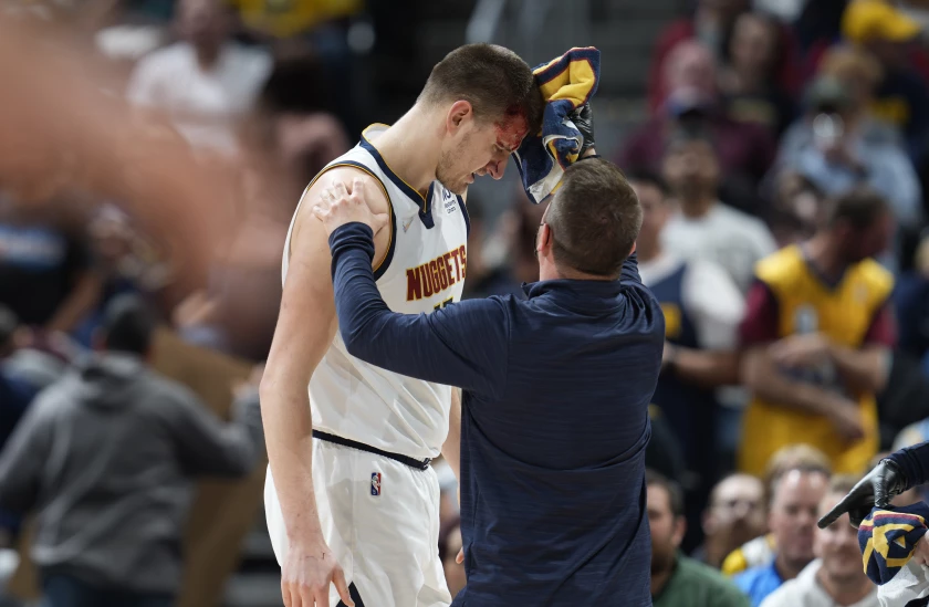 Nuggets settle in playoffs, beating Grizzlies