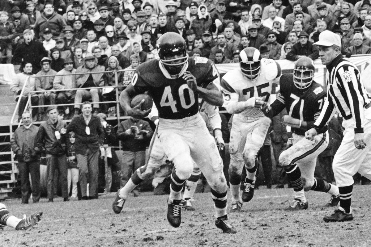 Chicago Bears running back Gale Sayers runs for a 28-yard gain against the Los Angeles Rams on Oct. 27, 1969.
