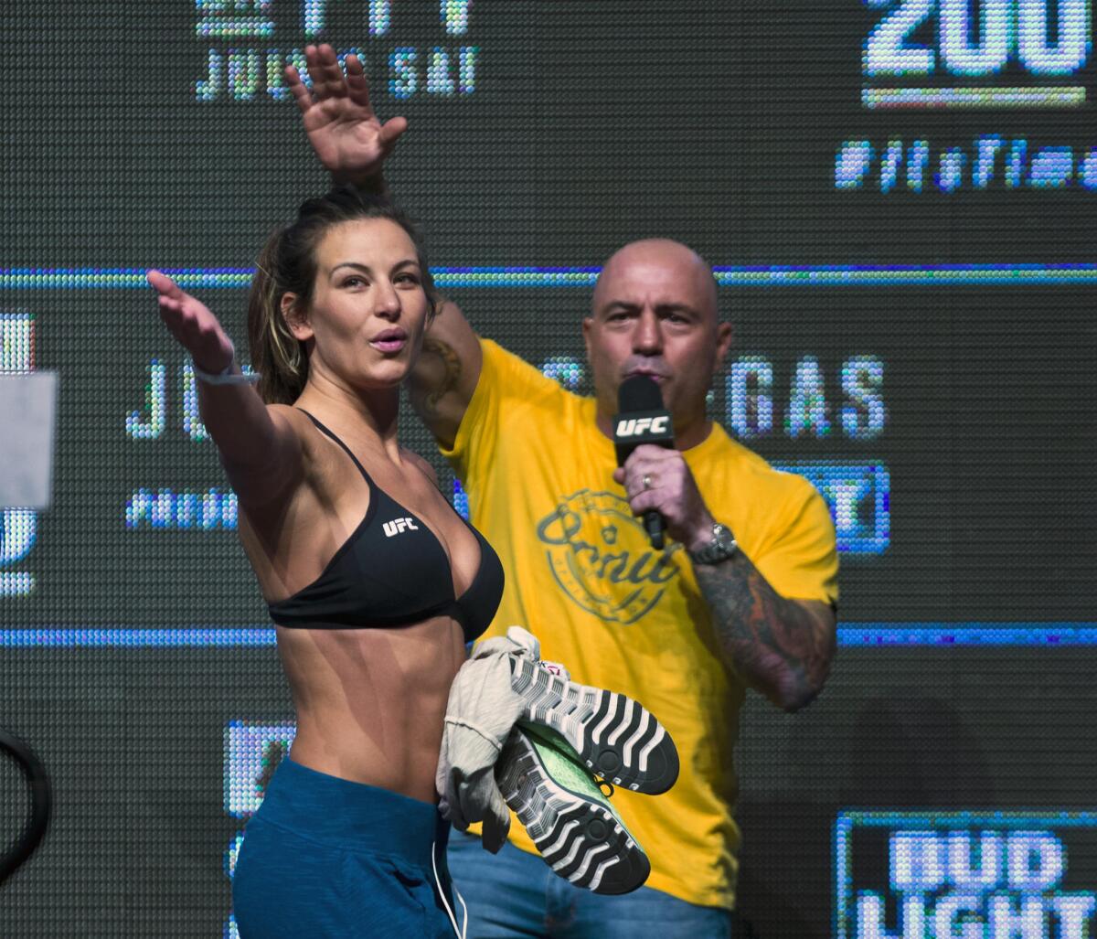 Miesha Tate salutes the fans after an interview with Joe Rogan during the UFC 200 weigh-ins in Las Vegas on July 8.
