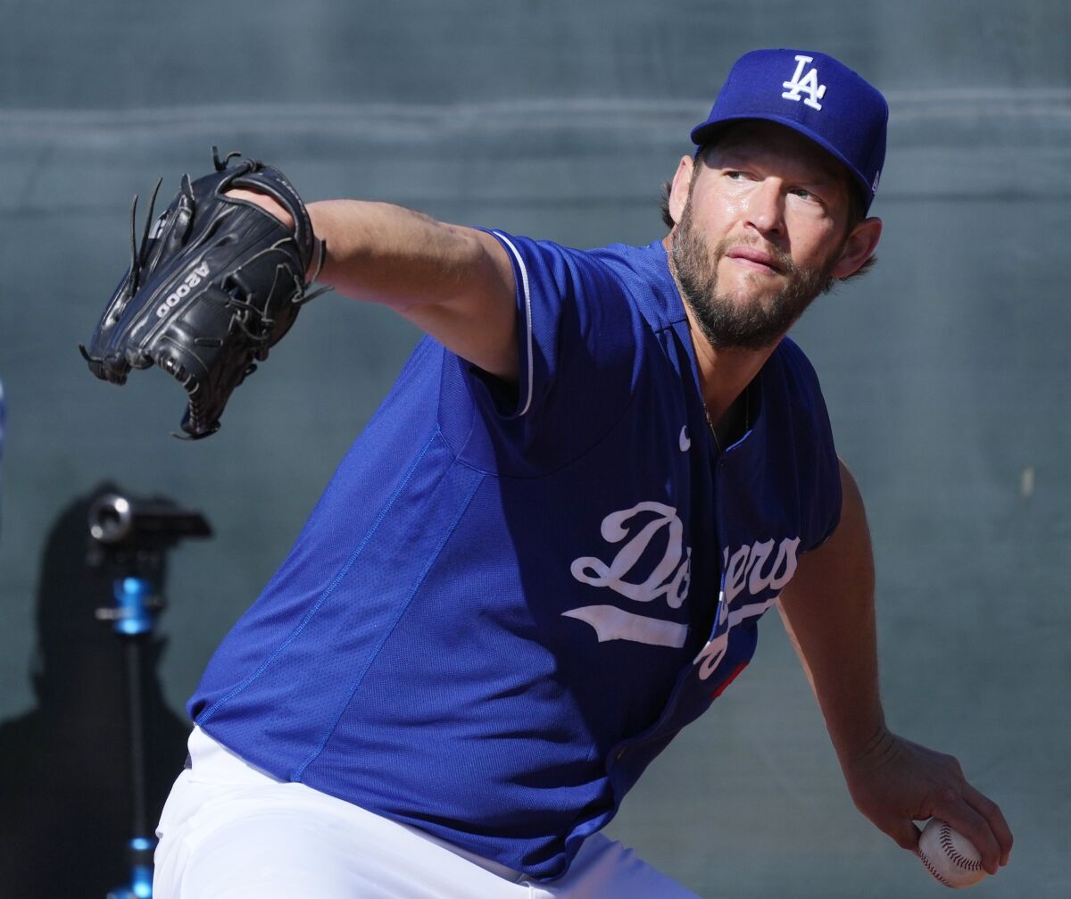 Dodgers starting pitcher Clayton Kershaw throws during the first day of spring training