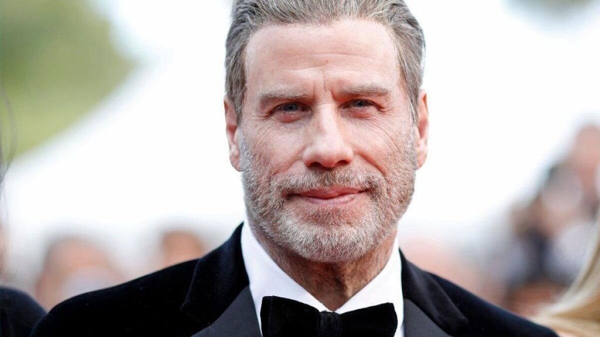 John Travolta arrives Tuesday for the screening of 'Solo: A Star Wars Story' during the 71st annual Cannes Film Festival, in Cannes, France.