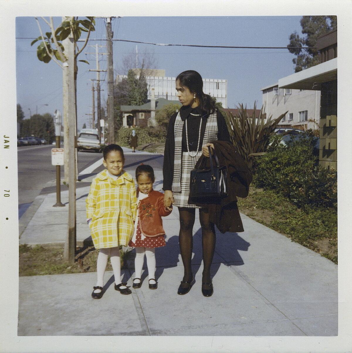 This January 1970 photo provided by the Kamala Harris campaign shows her, left, with her sister, Maya