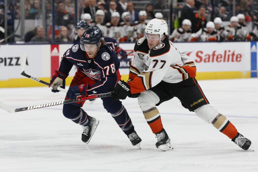 Columbus Blue Jackets' Damon Severson, left, and Anaheim Ducks' Frank Vatrano chase the puck during the third period of an NHL hockey game Tuesday, Oct. 24, 2023, in Columbus, Ohio. (AP Photo/Jay LaPrete)