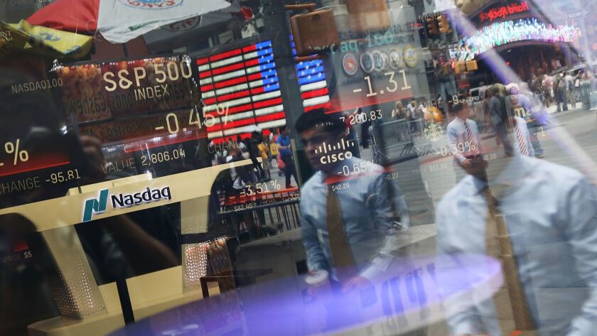 Reflections in the window of the Nasdaq MarketSite in Times Square.