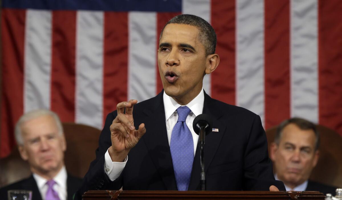 President Obama, flanked by Vice President Joe Biden and House Speaker John Boehner of Ohio, gestures as he gives his State of the Union address.